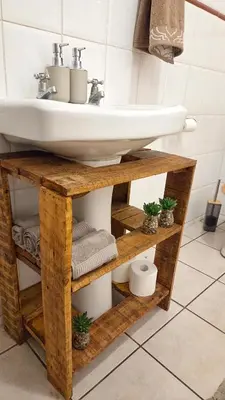 a bathroom with a sink on a wooden stand at Dika Dika Den in Phalaborwa