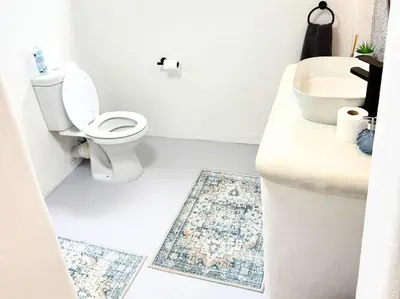 a bathroom with a toilet and a sink at Blanche Guesthouse in Pretoria