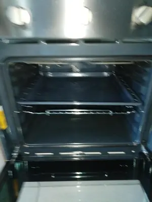 an oven with the door open in a kitchen at MamelaniQhibi Luxary Apartment in Nelspruit