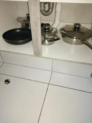 a counter with two pots and pans on a kitchen floor at MamelaniQhibi Luxary Apartment in Nelspruit