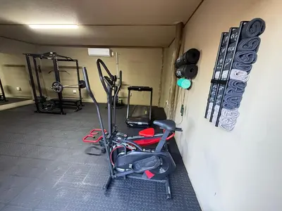 a room with a gym with a exercise bike at Moyo Safari Lodge in Alldays