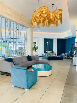 a living room with a couch and a table at Cozy abode in Pretoria