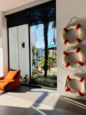 a room with a large glass door with a lifesaver at Cozy abode in Pretoria