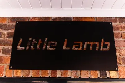 a sign on a brick wall with the word intelligence at Farmco Marloth Park in Marloth Park