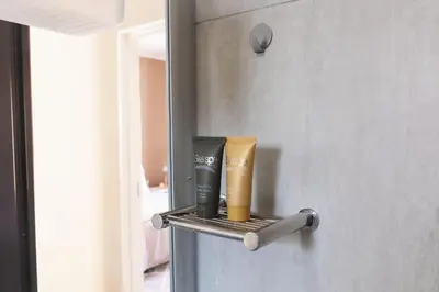 a shelf with two products on a refrigerator at Matusadona Suites in Mokopane