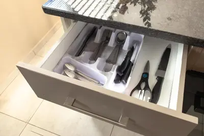 a drawer with scissors and other kitchen utensils at Matusadona Suites in Mokopane