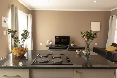 a kitchen with a stove top on a counter at Matusadona Suites in Mokopane