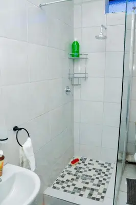 a bathroom with a shower and a sink at Springs Sleeper's Delight in Springs