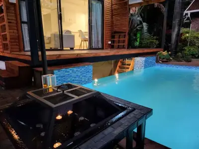 a pool with a table in the middle of a house at African Diamond - Date Night Suite in Benoni