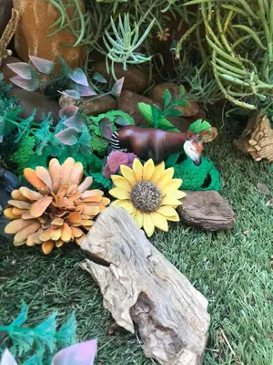 a model of a garden with flowers and a frog at African Diamond - Date Night Suite in Benoni