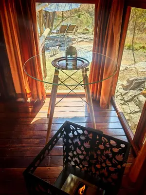 a glass door with a table on a porch at Lethabo Estate in Lanseria
