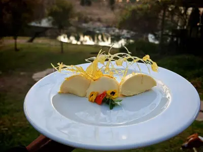 a white plate with food on top of it at Lethabo Estate in Lanseria