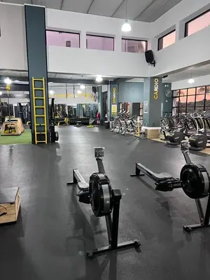 a gym with several exercise equipment in a room at The Corinthians Lagoon facing in Pretoria