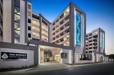 a large building with a sign in front of it at Stay at Regency Luxe One in Pretoria