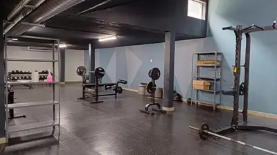 a gym with several treadmills and machines in a room at The 210 Circa Pretoria Studio in Pretoria