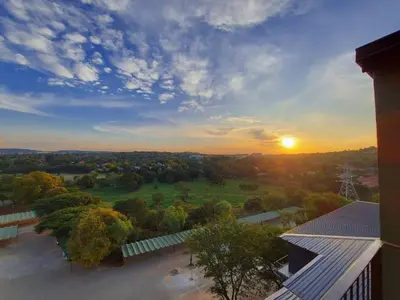 an overhead view of a field with the sunset in the background at The 210 Circa Pretoria Studio in Pretoria
