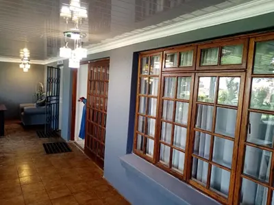 a hallway with doors and windows in a house at M and E Lodge in Enkelbosch