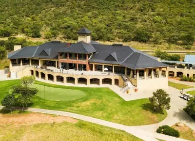 an aerial view of a large house with a golf green at Euphoria Self Catering Home in Naboomspruit