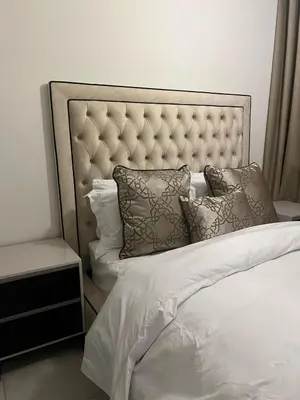 a white bed with a padded headboard and pillows at The Blyde Crystal lagoon in Pretoria