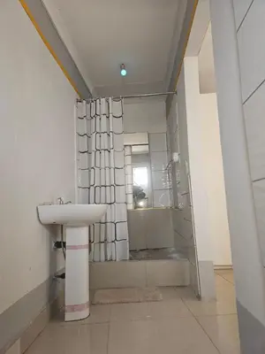 a bathroom with a sink and a mirror at TURFLOOP guest house in Mankweng