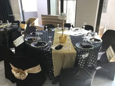 a table with black and white polka dot tables and chairs at Makhasana