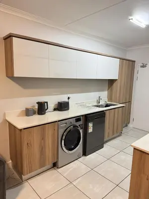 a kitchen with a washing machine and a sink at The Dream Stay At The Blyde - Suite 3 in Pretoria