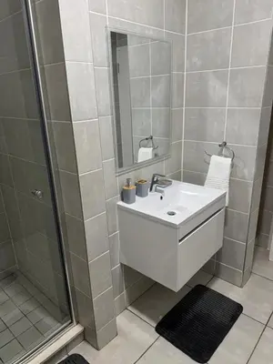 a bathroom with a sink and a shower at The Dream Stay At The Blyde - Suite 3 in Pretoria