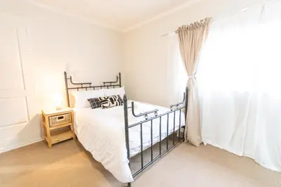 a bedroom with a bed and a window at 28 Schalk drive in Polokwane