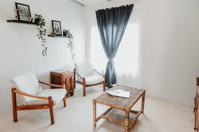 a living room with chairs and a table and a window at 28 Schalk drive in Polokwane