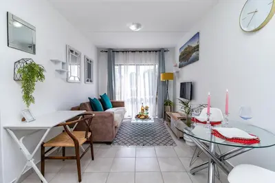 a living room with a couch and a table at Willow House Oasis - Your Haven in Kempton Park
