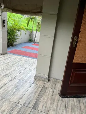 an open door of a house with a porch at Nzwaki Self Catering in Nelspruit
