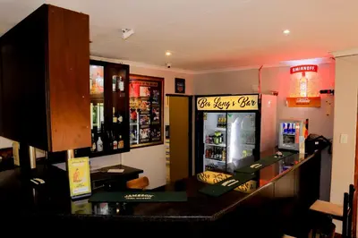 a bar in a restaurant with a soda shop at Masai Shuttles And Hotel in Polokwane