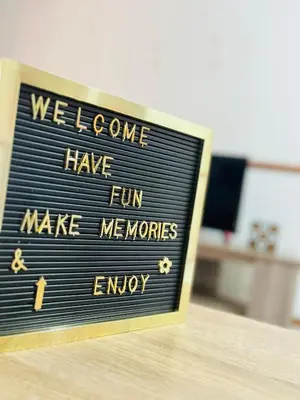 a sign that says welcome have fun make memories and enjoy at Intsika apartments in Nelspruit