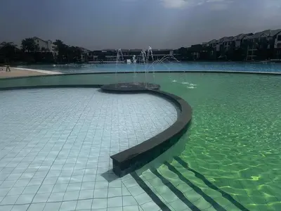 a fountain in the middle of a body of water at The Blyde Blue Lagoon 1 in Pretoria