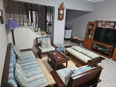 a living room with couches and a flat screen tv at Luxury Meets Convenience Near City & Travel Links in Pretoria