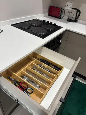 a drawer in a kitchen with some scissors at Tranquil Stays in Polokwane