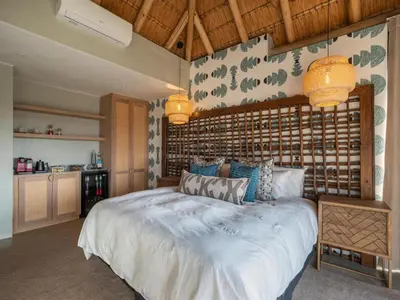 a bedroom with a large white bed in a room at Tintswalo Scops Rest in Klaserie Private Nature Reserve