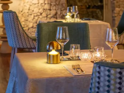 a table with wine glasses on top of it at Tintswalo Scops Rest in Klaserie Private Nature Reserve