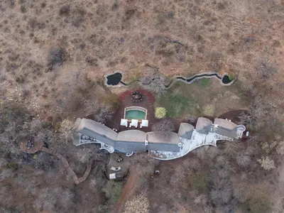 an aerial view of a house with a barn at Tintswalo Scops Rest in Klaserie Private Nature Reserve