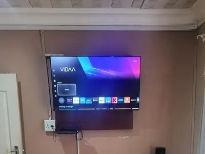 a flat screen tv on a wall at Villa Hadassa and Spa in Burgersfort