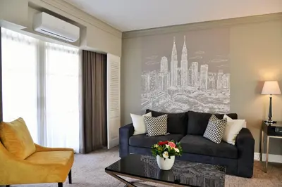 a living room with a couch and a table at Hotels Near OR Tambo Airport Booked Easy in Johannesburg