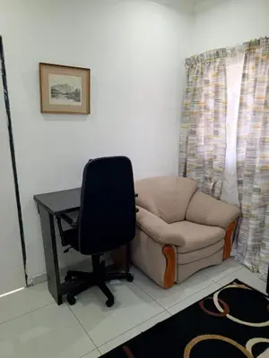 a room with a desk and a chair and a desk and a chair at Millenium Manor in Centurion