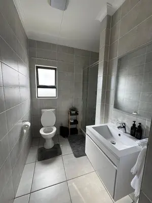 a bathroom with a toilet and a sink at Lagoon lounge - The blyde crystal Lagoon in Pretoria