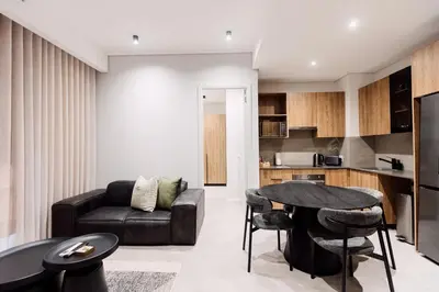 a living room with a couch and a table at 532 Menlyn Maine in Pretoria