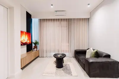 a living room with a couch and a fireplace at 532 Menlyn Maine in Pretoria