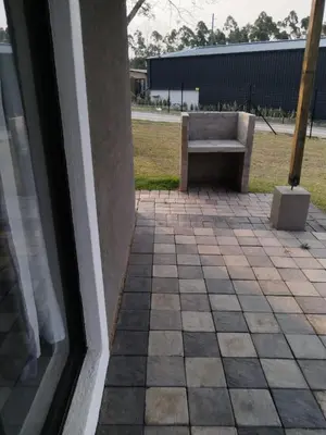 a window with a bench in front of a building at Aloe Thorn Self Catering in White River