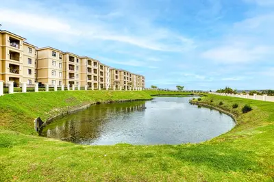 a pool of water in front of a building at TruVela Executive Apartments - Midrand in Midrand