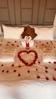 a bed with a heart made out of roses at 19 on Idwala, Mabalingwe Game Reserve in Warmbaths