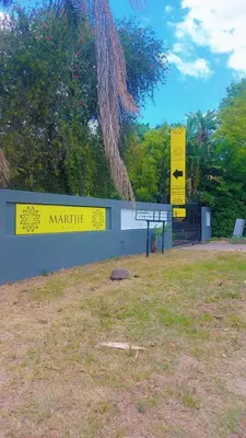 a sign for a park with a sign for marmite at Eight Martjie Guesthouse in Brits