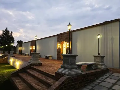 a row of lights on a building at night at Beds Inn Midrand in Midrand